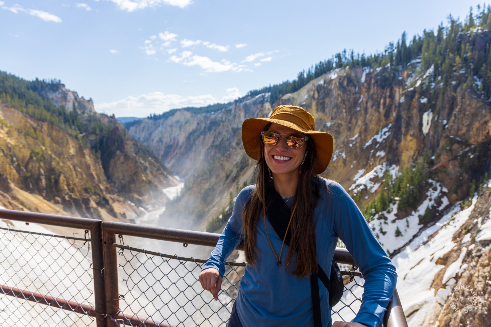 Lauren at Brink of Lower Falls overlook in the Grand Canyon of Yellowstone